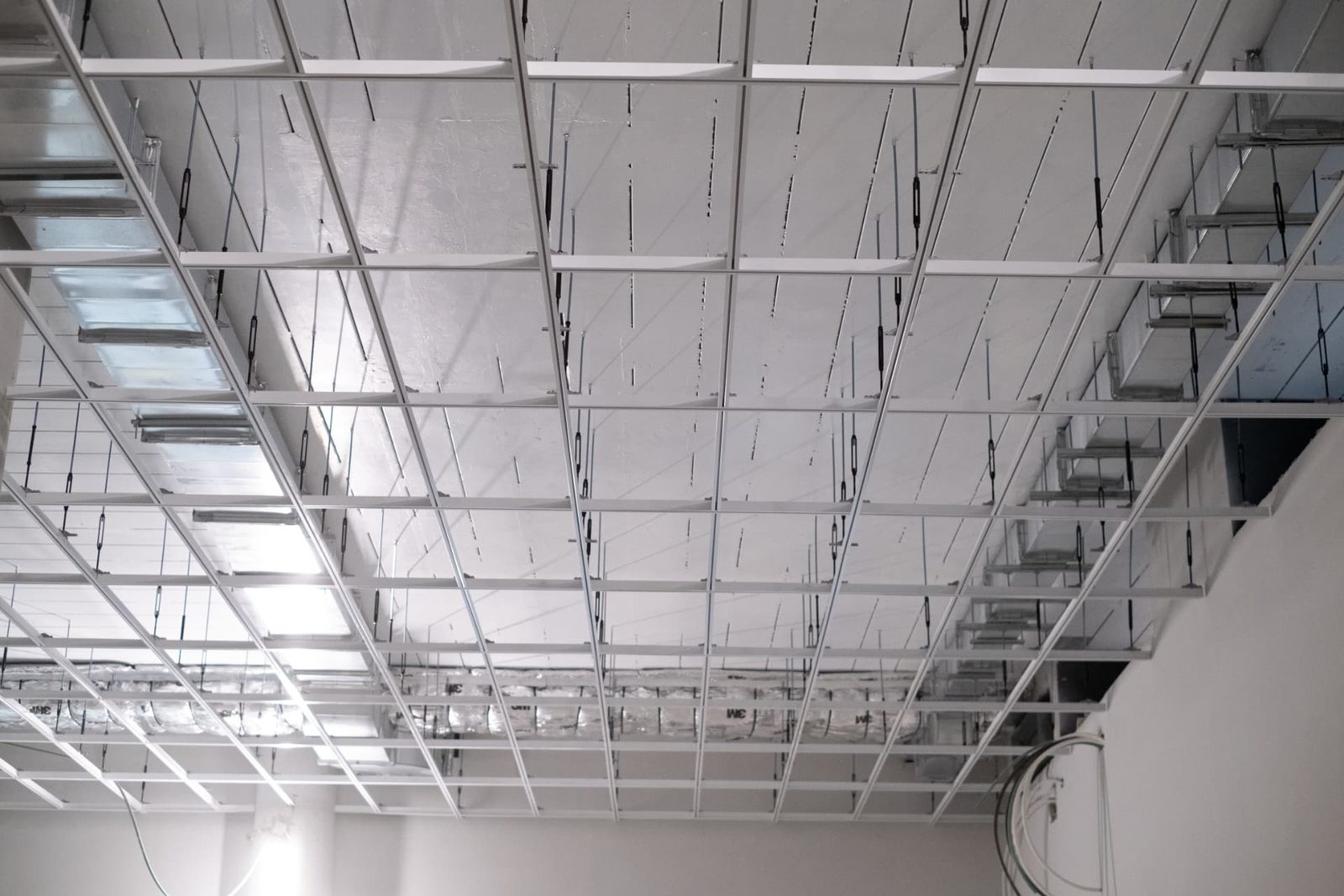 Grid ceiling detail with suspension hardware